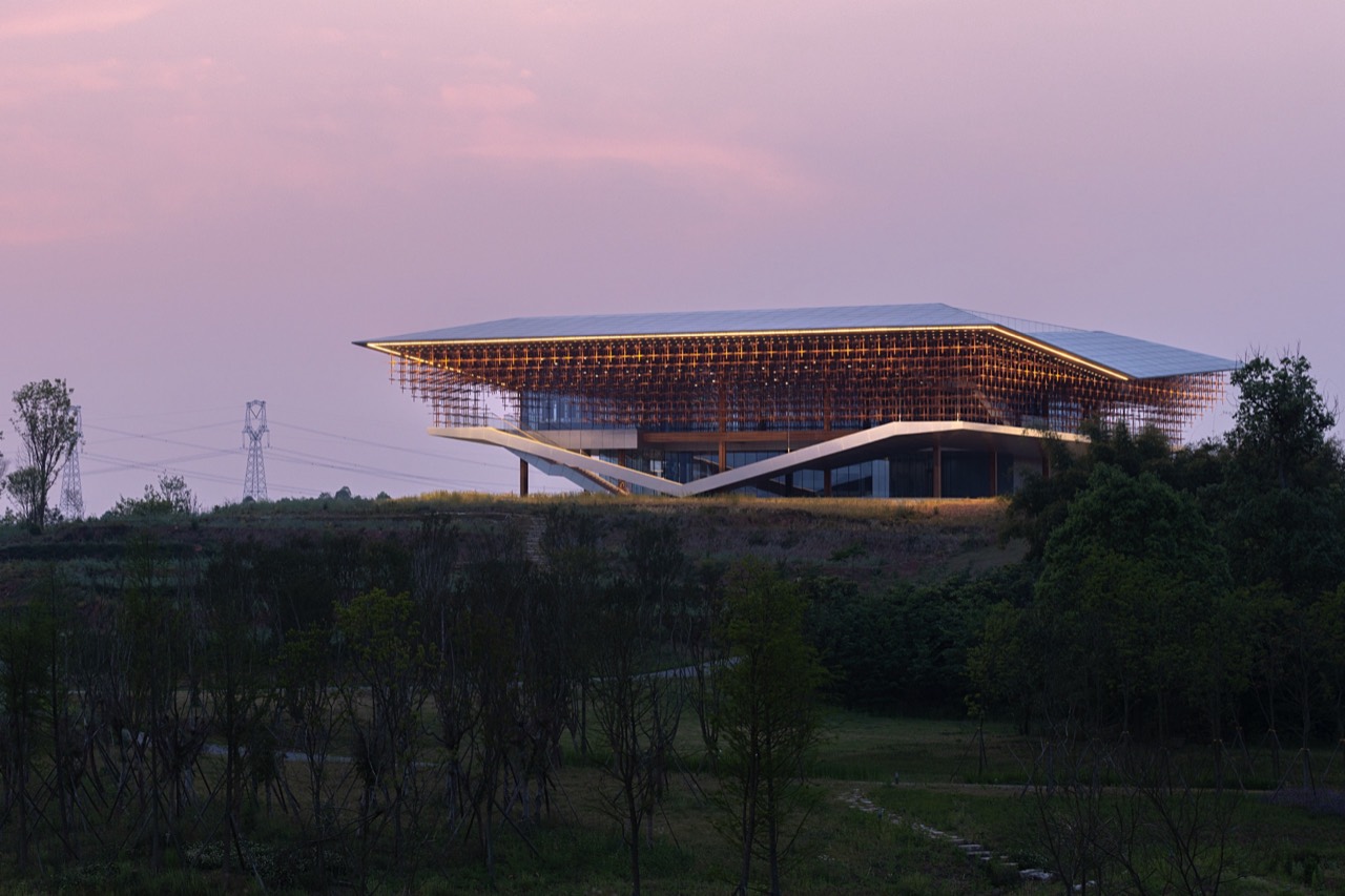 Illuminated AND Studio building at dusk